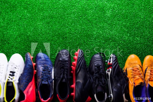 Picture of Various cleats against green artificial turf studio shot